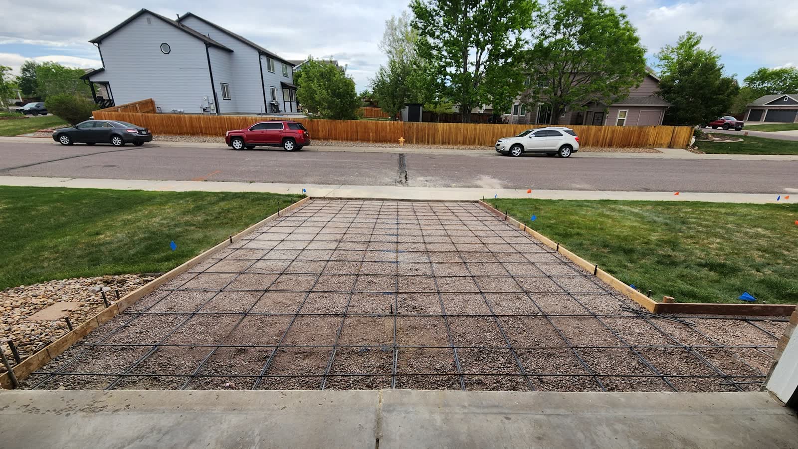 A rebar grid tied inside driveway forms, ready for the pour